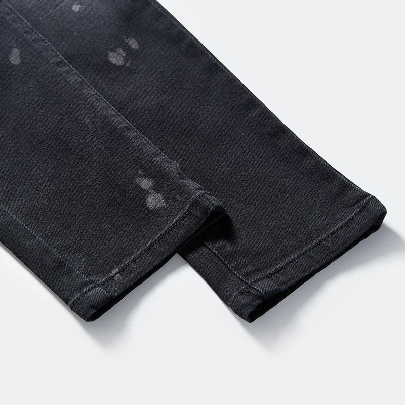 kids-black-paint-splatter-graphic-slim-jeans-s26ipkj101-paint-splatter-leg-detail