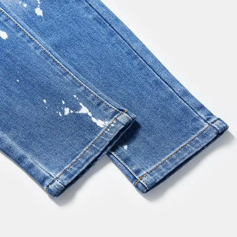 kids-blue-paint-splatter-distressed-slim-jeans-s26ipkj101-paint-splatter-leg-detail