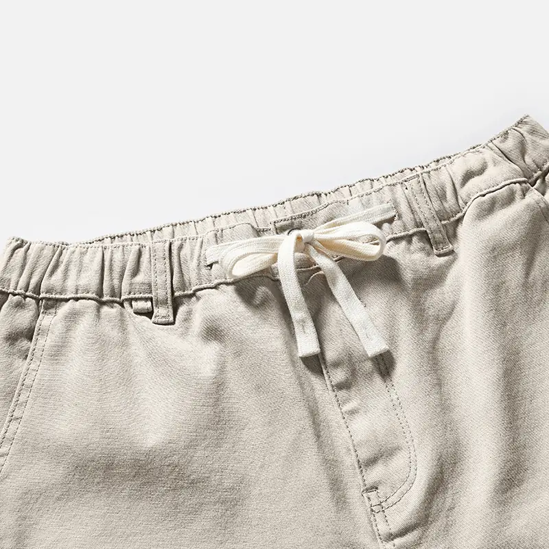 Elasticated drawstring waist detail on beige denim pants style 4E801