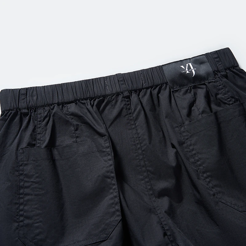 Back waistband and patch pocket detail on black cargo jogger style 1-2116