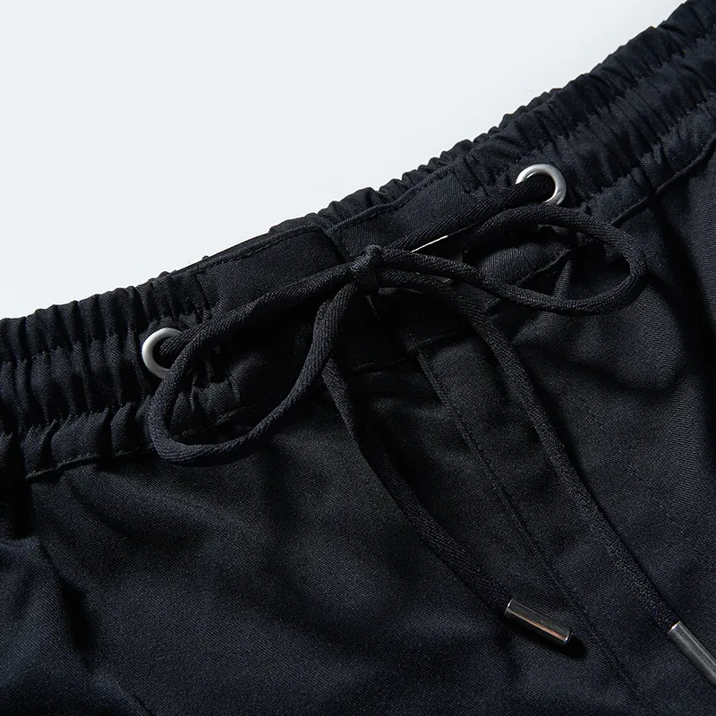 Black drawcord and metal eyelet detail on cargo pants style 76032