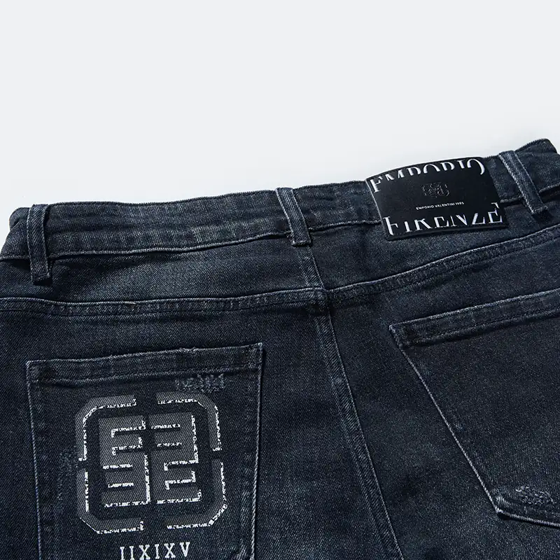 Back waistband and embossed pocket artwork on dark indigo jeans style DJFW2508M