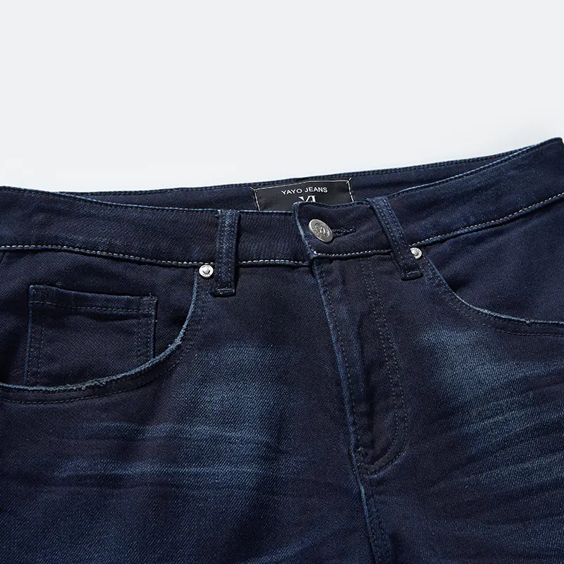 Button waist, coin pocket and whisker wash detail on jeans style 68010
