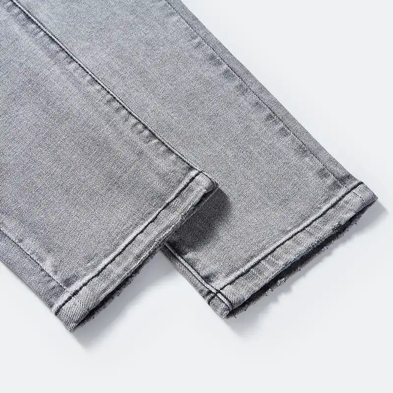 Clean tapered hem and seam detail on grey jeans style DJFW2508M