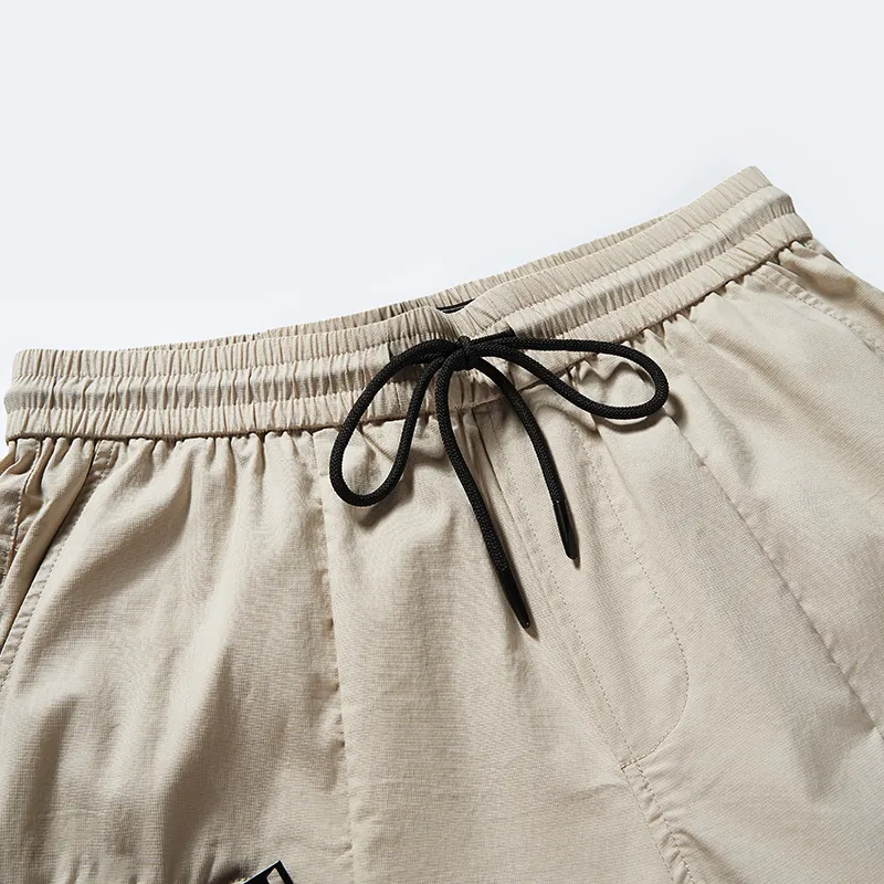 Elastic waistband and black drawcord detail on cargo joggers style 8244003