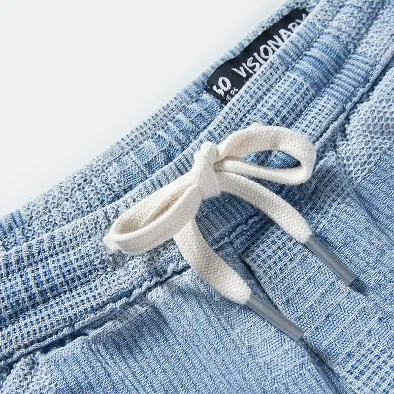 Drawcord and waistband construction detail on denim pants style 4164556