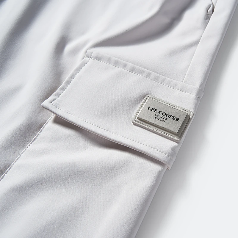 Flap cargo pocket and label placement detail on men's jogger pants style 1-2115