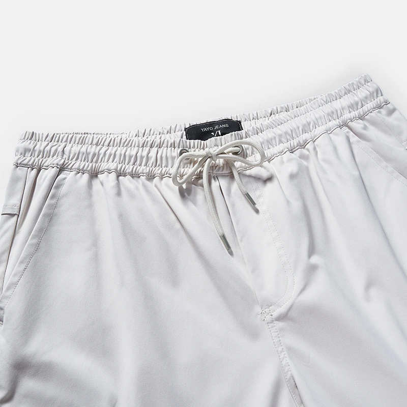 Elasticated drawstring waistband detail on men's cargo jogger style 1-2115
