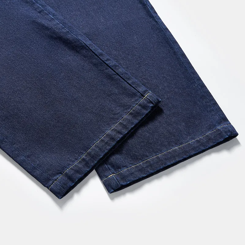 Wide-leg hem construction detail on dark indigo jeans style 57065