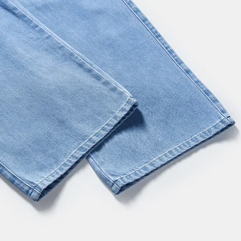 Wide-leg hem detail on light wash women's jeans style 58002