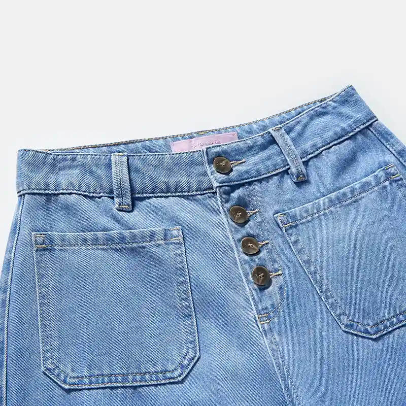 Exposed button fly and front patch pocket detail on jeans style 58002